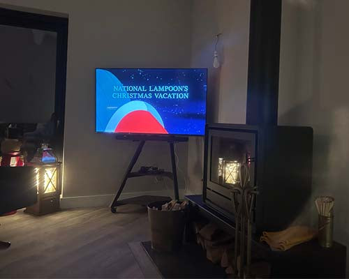 fireplace with tv stand by the side, modern living room setup