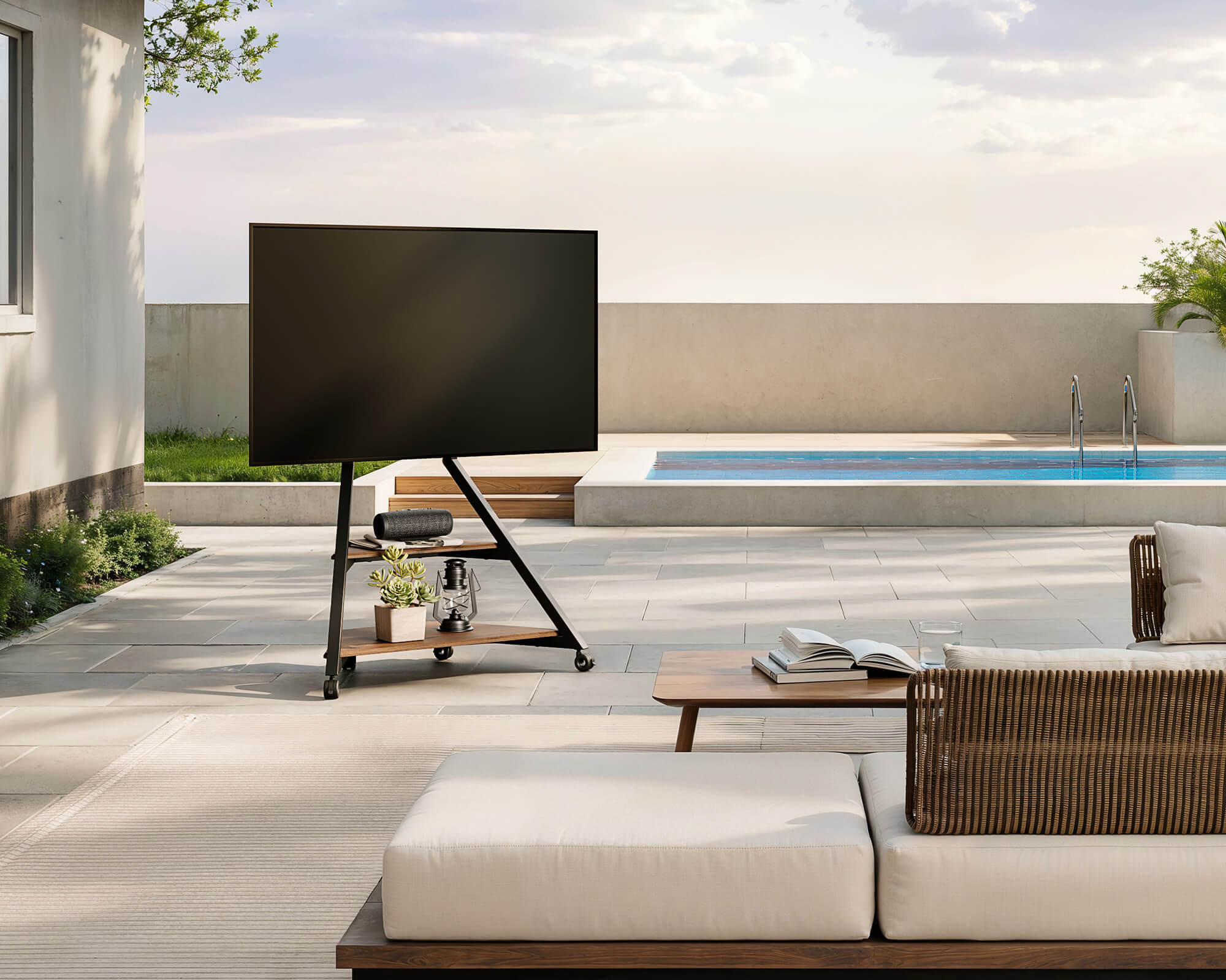 Modern portable tv stand placed beside a poolside garden area