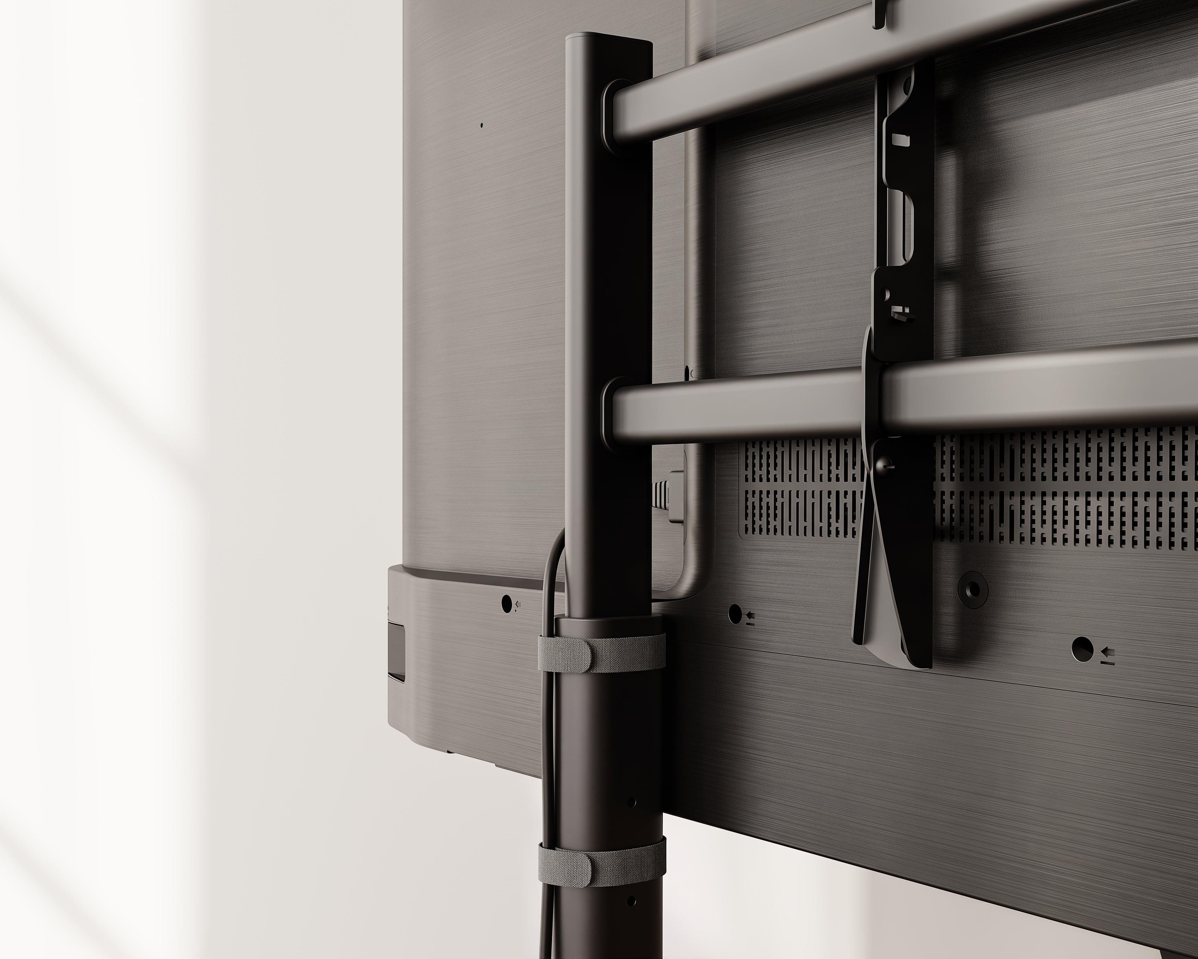 Rear cable management detail on the black K TC85 S2 rolling television stand