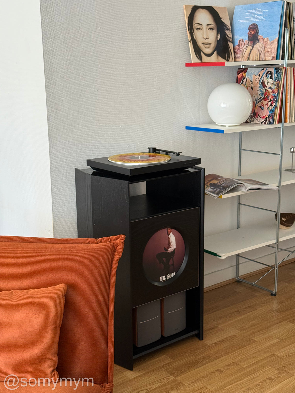 A personal listening corner with a white paper pendant